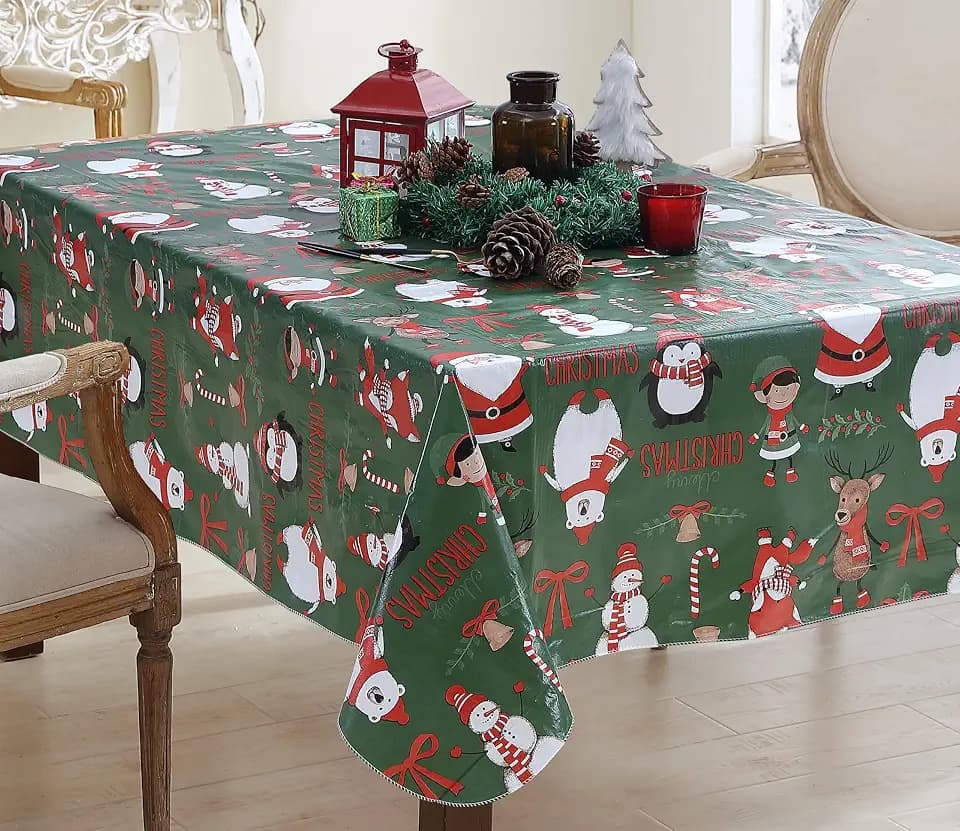 Newbridge Holiday Critters Christmas Vinyl Tablecloth with Flannel Backing – 52 x 70 Inch Rectangle – Cute Santa, Snowman, Penguin, Elves & Reindeer Print Easy-Care Wipe Clean Table Cover