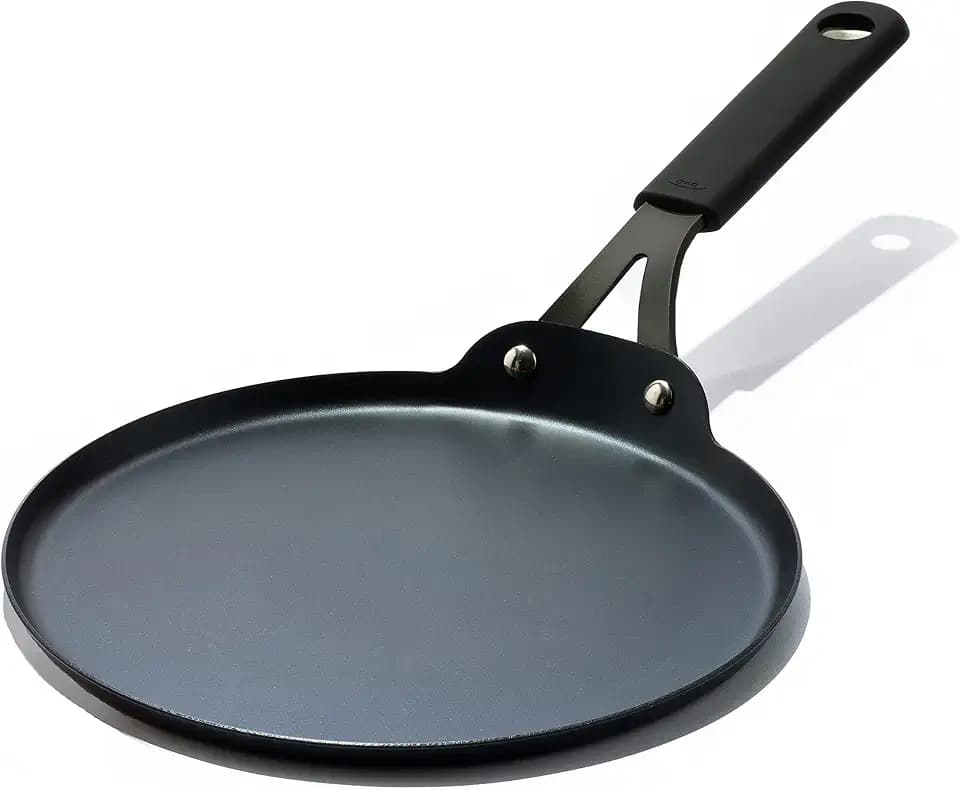OXO Obsidian Pre-Seasoned Carbon Steel, 10" Crepe and Pancake Griddle Pan with Removable Silicone Handle Holder, Induction, Oven Safe, Black