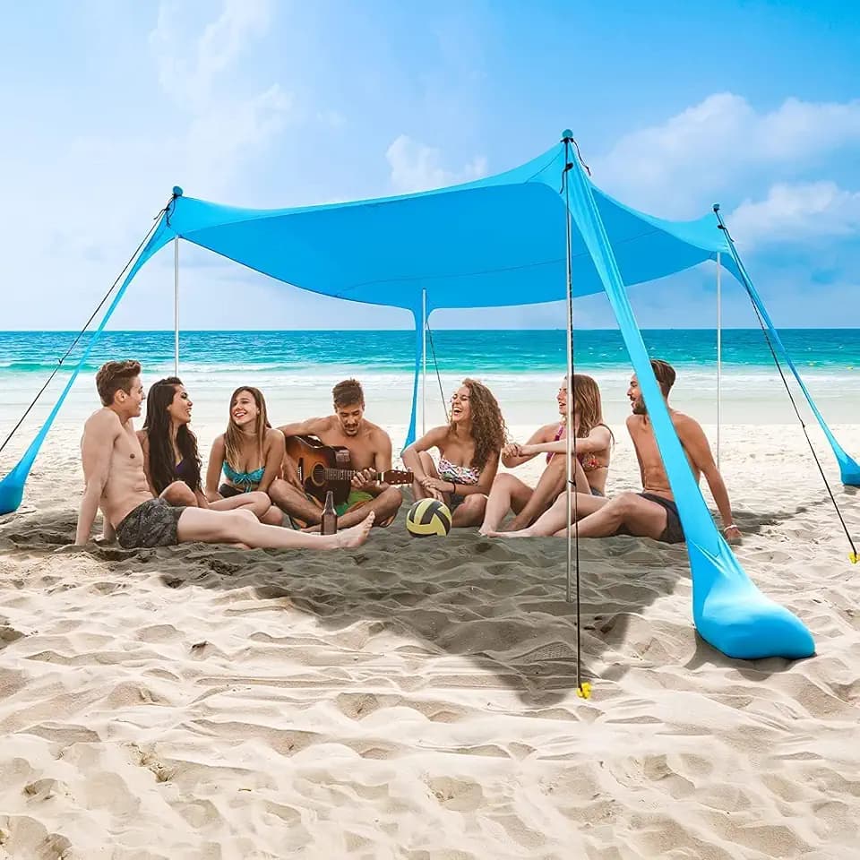 COMMOUDS Sonnenschutz Strand,UPF50+ Sonnensegel Strand Strandmuschel Tragbarer Strandzelt mit 4 Aluminiumstangen und Sandsäcken, Einfacher Aufbau für Picknick 3M x 3M Himmelblau