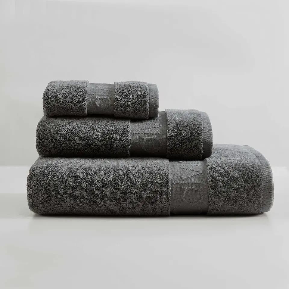 Calvin Klein - Bath Towels, Super Soft & Absorbent Cotton Towels, Zero Twist Construction, Brand Locker Loop for Easy Hanging (Iconic Solid Grey, 3 Piece)