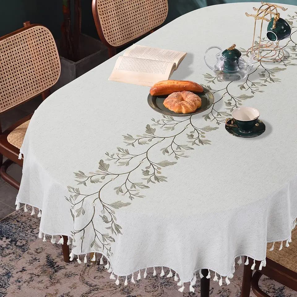 HOMBYS Solid Embroidery Oval Tablecloth with Tassels for Oval Table, 60 x 84 Inch Lace Dust-Proof Table Cover for Kitchen Dinning, Wrinkle Free Anti-Fading Tabletop Decoration, Natural